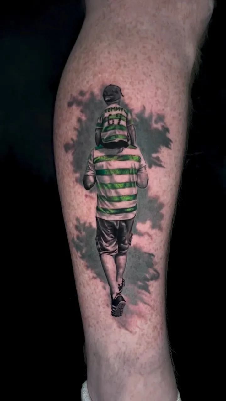 a father carrying his son on his shoulders, both in green and white hooped shirts, colour realism tattoo by Lucas Zatti, Temple Bar Dublin