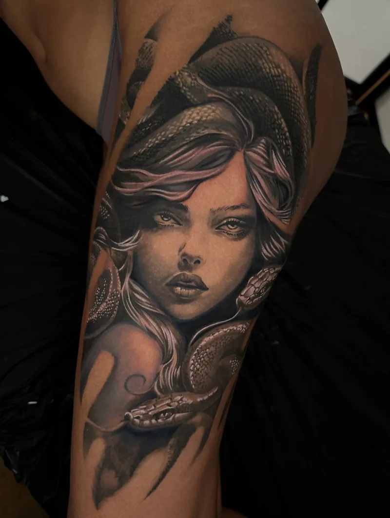 a Medusa portrait with serpents on the thigh, black and grey realism tattoo by Lucas Zatti, Temple Bar Dublin